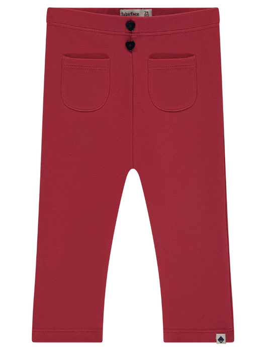 Scarlet red front pocket pants for baby girls, with a button closure and a tag visible on the side.