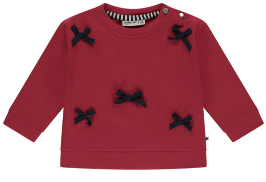 A red sweatshirt with petite grosgrain bows on it, designed for baby girls.
