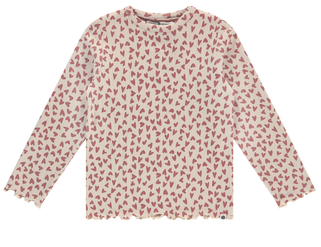 Long-sleeved dusty pink top with an all-over heart pattern and ruffle detailing at the sleeves and bottom.