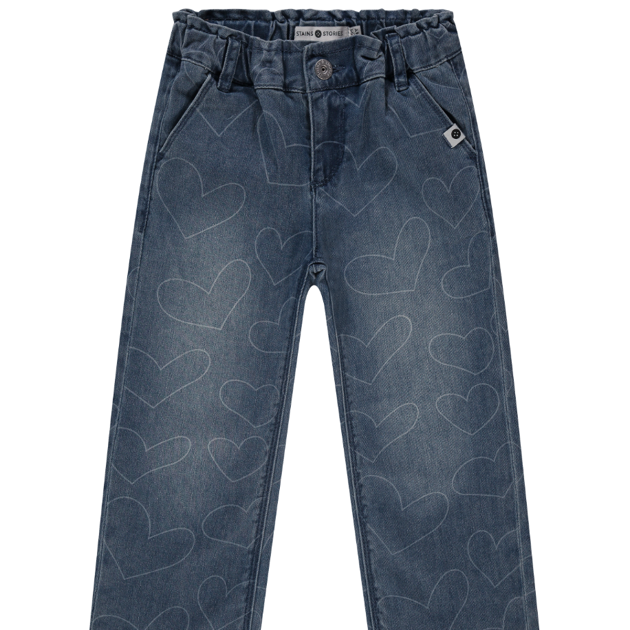 A pair of blue denim jeans for girls with a heart pattern and an elastic waistband.