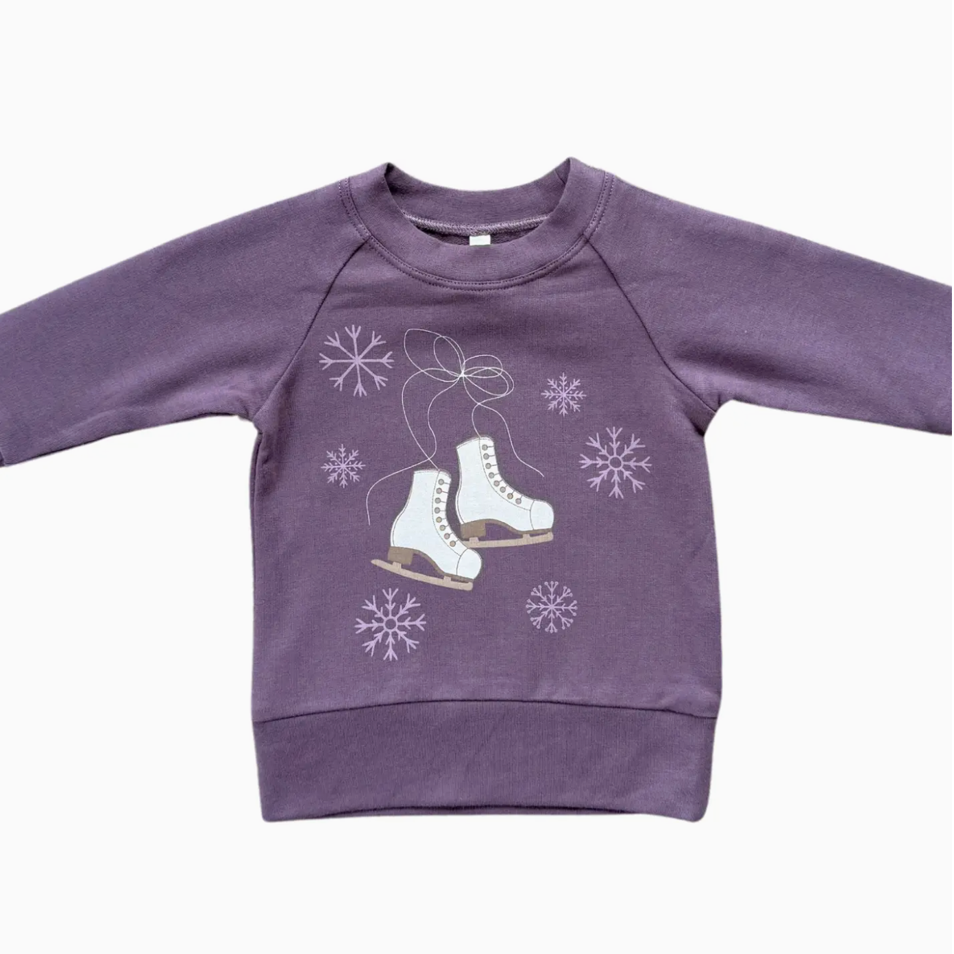 Purple sweatshirt with ice skate and snowflake design on a white background
