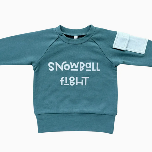 Blue sweatshirt with 'SNOWBALL FLIGHT' text on a white background