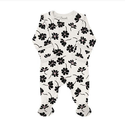 White baby onesie with black floral pattern on a white background
