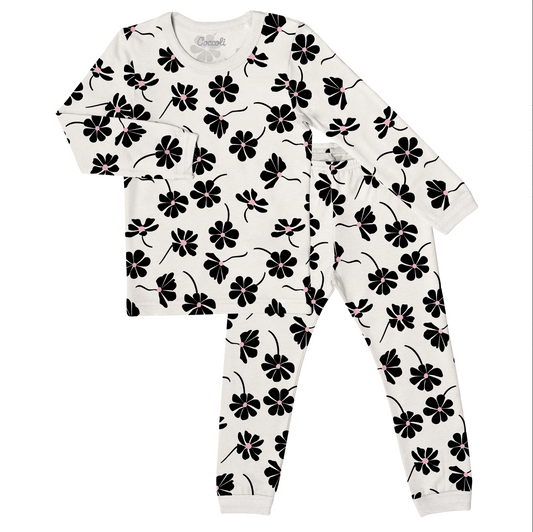Children's pajama set with black floral pattern on white background