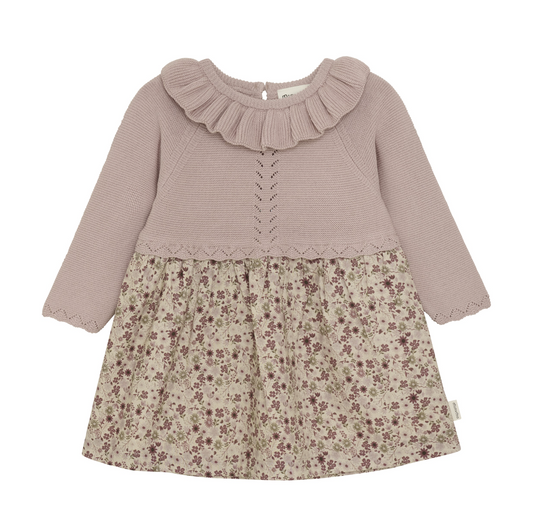 Children's dress with ruffled collar and floral skirt on a white background