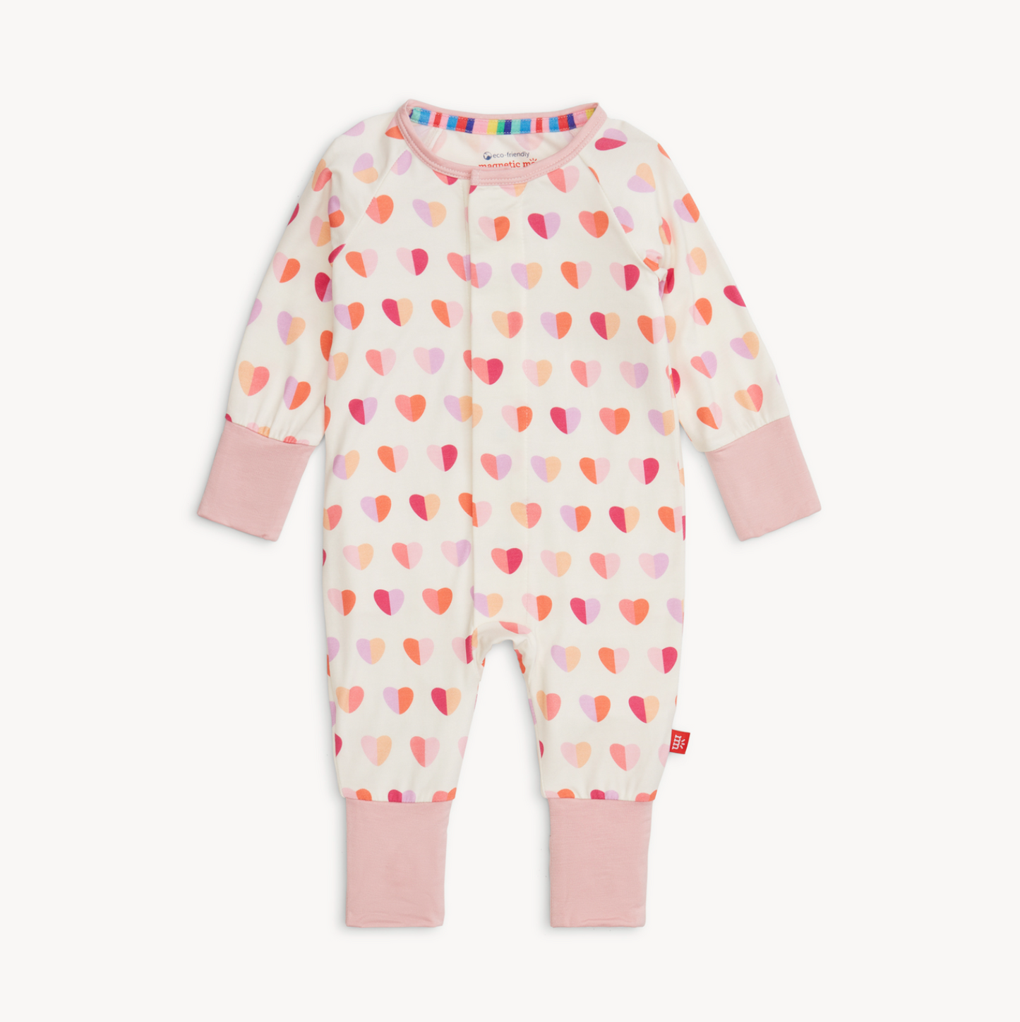 Baby onesie with heart pattern and pink accents on a white background