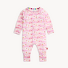 Pink baby onesie with cloud pattern on a white background