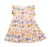 Children's dress with colorful cake and star pattern on a white background