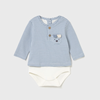 Baby outfit with striped shirt and white diaper on a light gray background