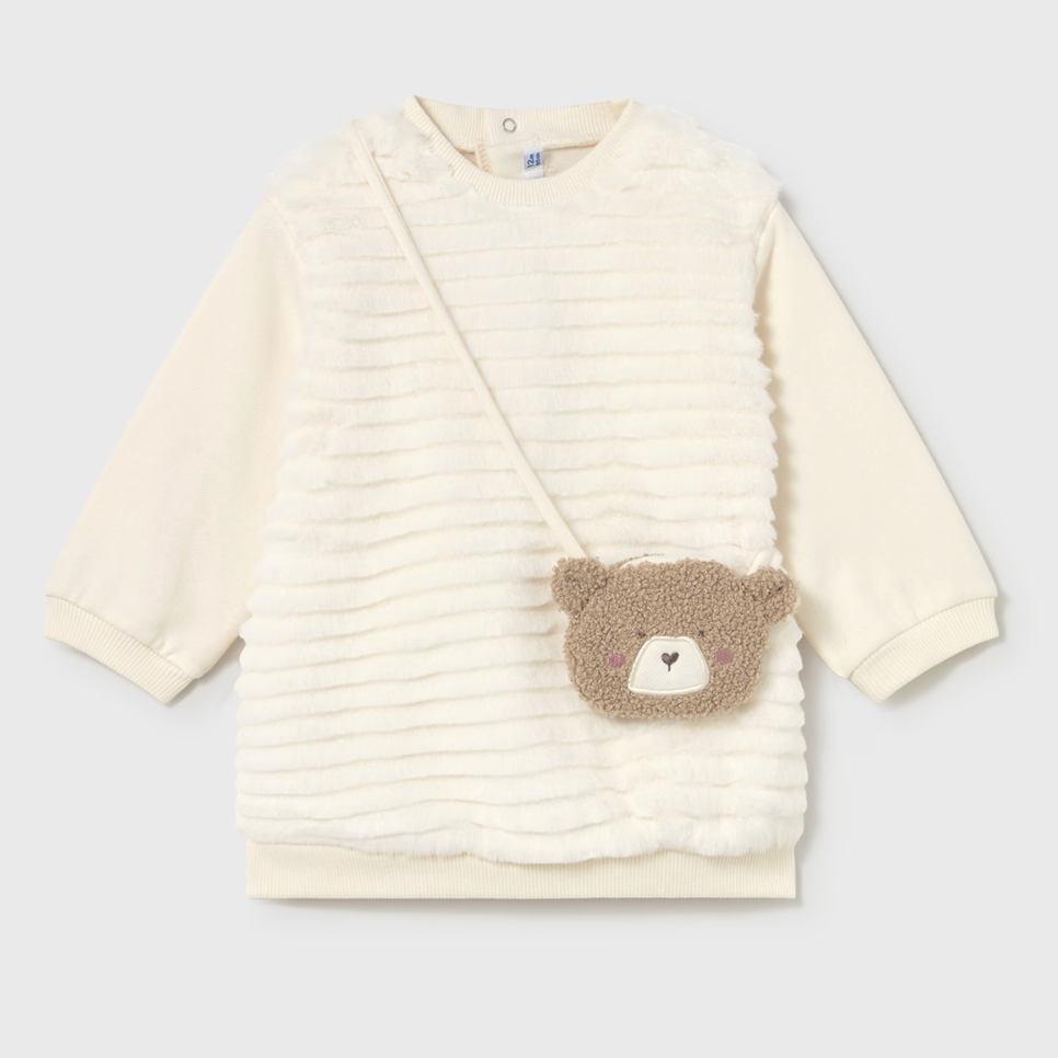 Baby sweater with bear patch on a light gray background