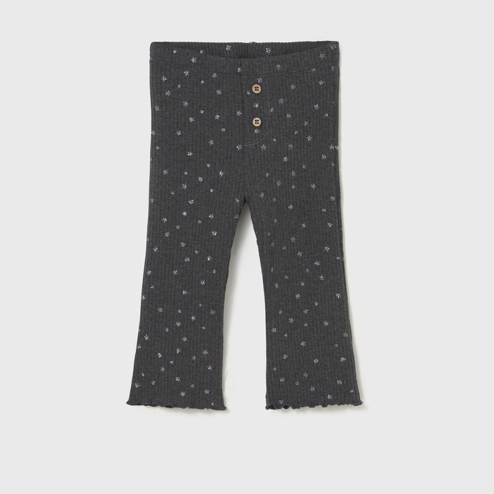 Dark gray leggings with small white patterns on a light gray background