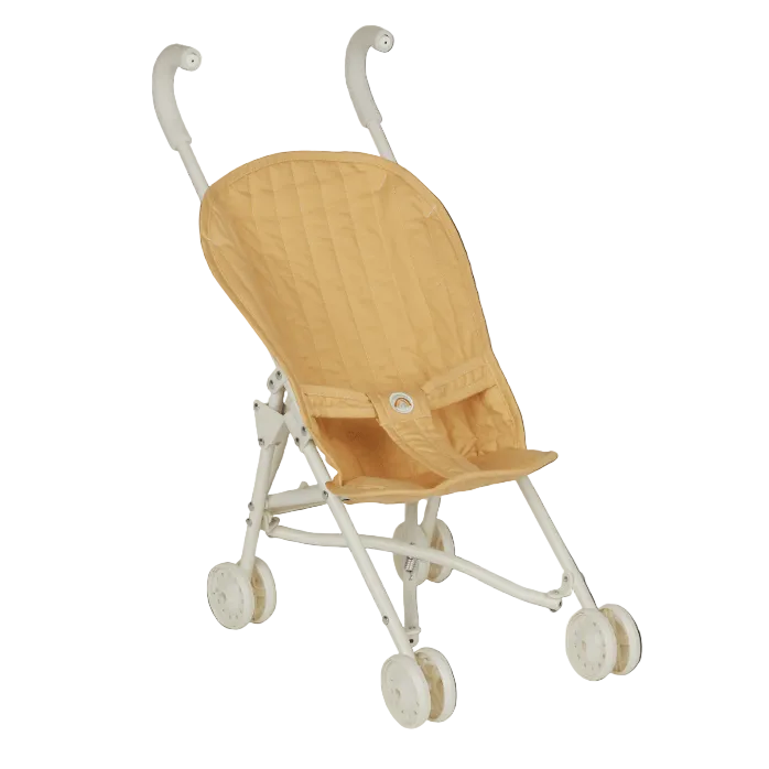 Beige baby stroller on a black background