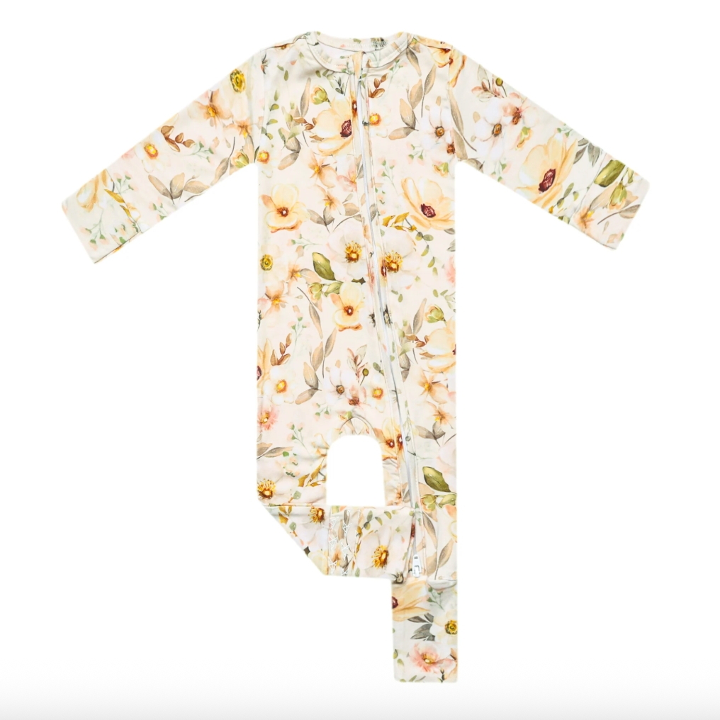 Floral-patterned baby onesie on a white background