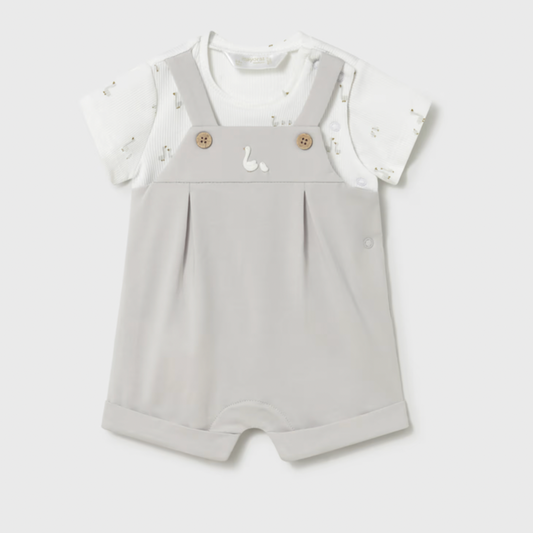 Baby romper with white top on a light gray background
