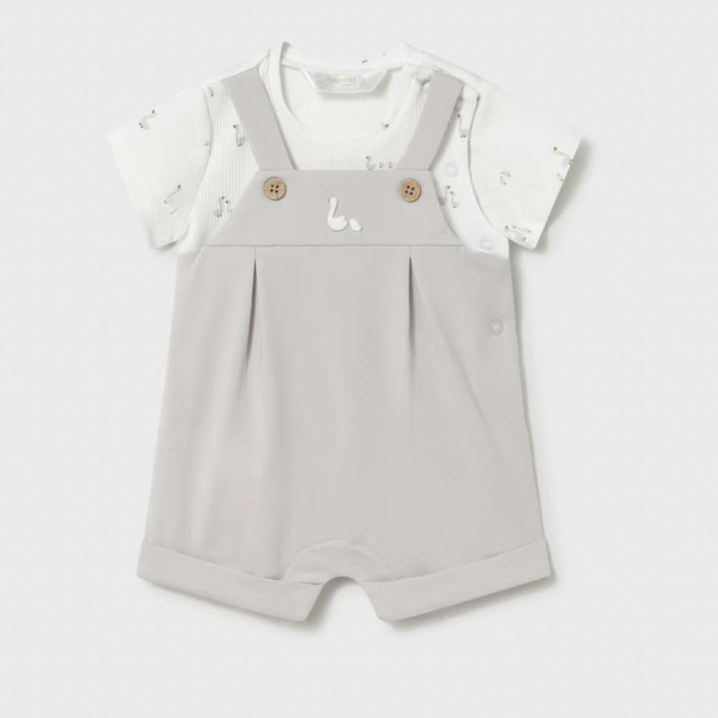 Baby romper with white top on a light gray background