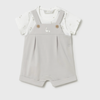 Baby romper with white top on a light gray background