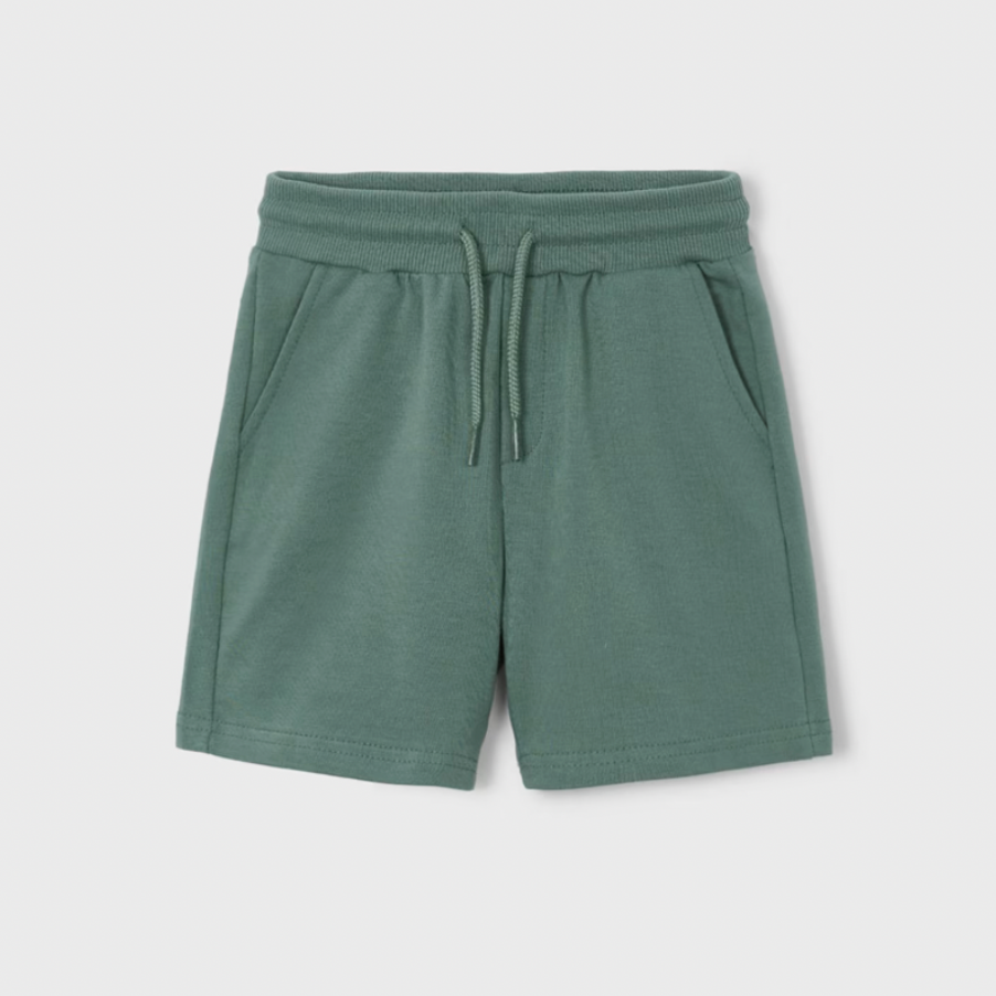 Green shorts with a drawstring on a light gray background