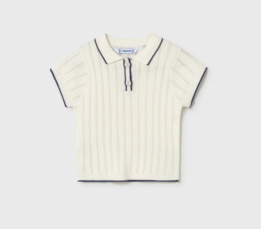White pointelle knit polo shirt with black trim on a light gray background