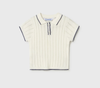 White pointelle knit polo shirt with black trim on a light gray background