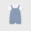 Blue knitted romper with white shirt on a light gray background