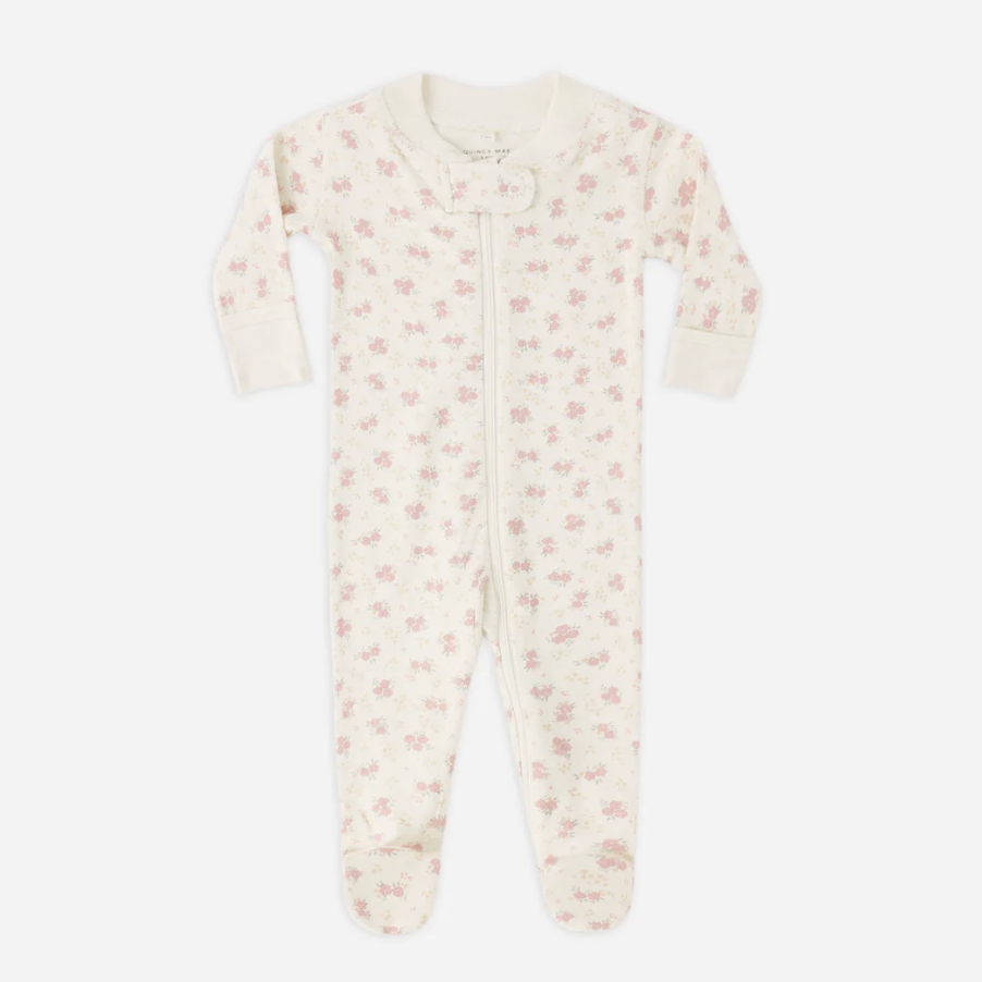 Baby onesie with floral pattern on a white background