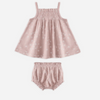 Pink baby dress and bloomers set on a white background