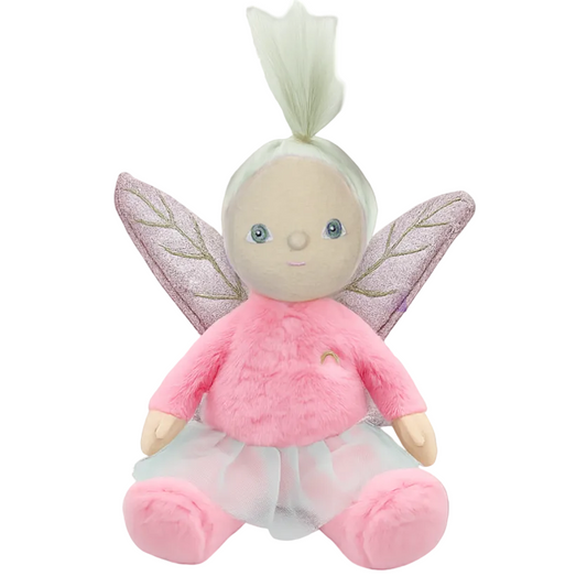 Plush fairy toy with pink outfit and wings on a brown background