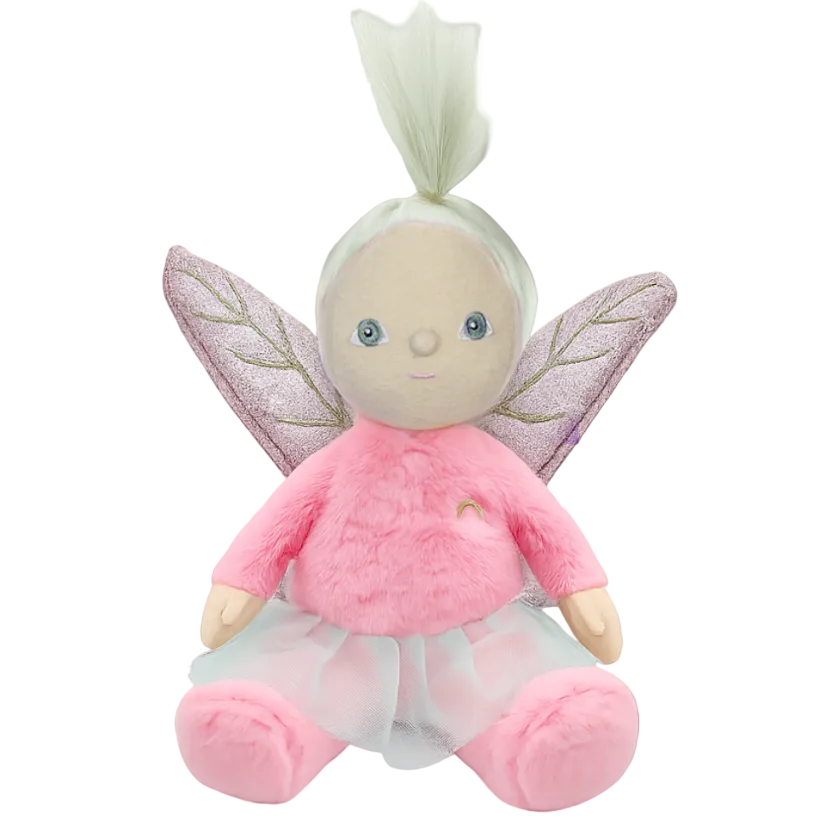 Plush fairy toy with pink outfit and wings on a brown background
