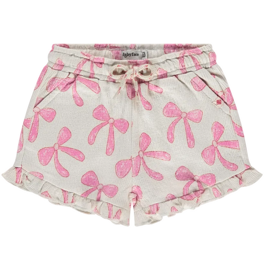 Shorts with pink bow pattern on a white background