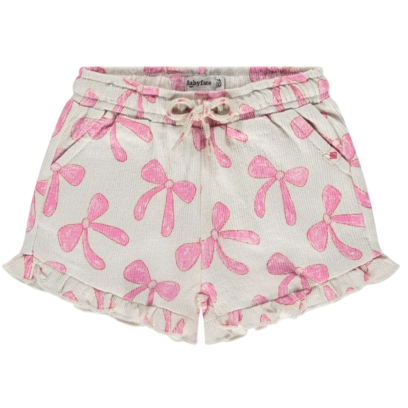 Shorts with pink bow pattern on a white background