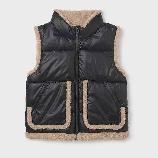 Black puffer vest with beige sherpa lining on a white background