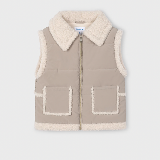 Beige vest with white collar and pockets on a light gray background