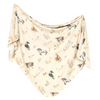 Beige baby blanket with horse pattern on a white background