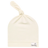 Beige baby hat with a knot on top on a white background, featuring the Copper Pearl brand.