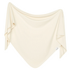 Beige fabric draped over a white background