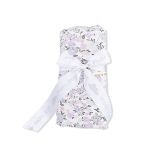 Floral-patterned swaddle wrap with a white ribbon 