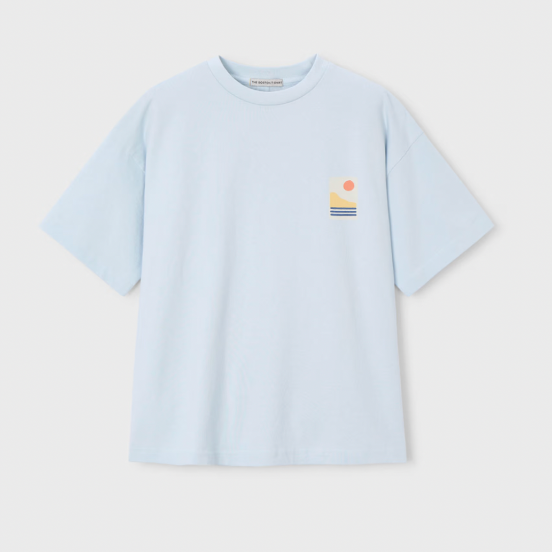 Light blue t-shirt with a small mountain logo 
