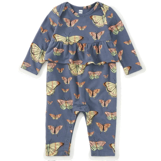 A baby long-sleeve romper in slate blue with an all-over butterfly print, featuring a ruffled peplum waist and snap closures at the crotch, shown flat on a white background.