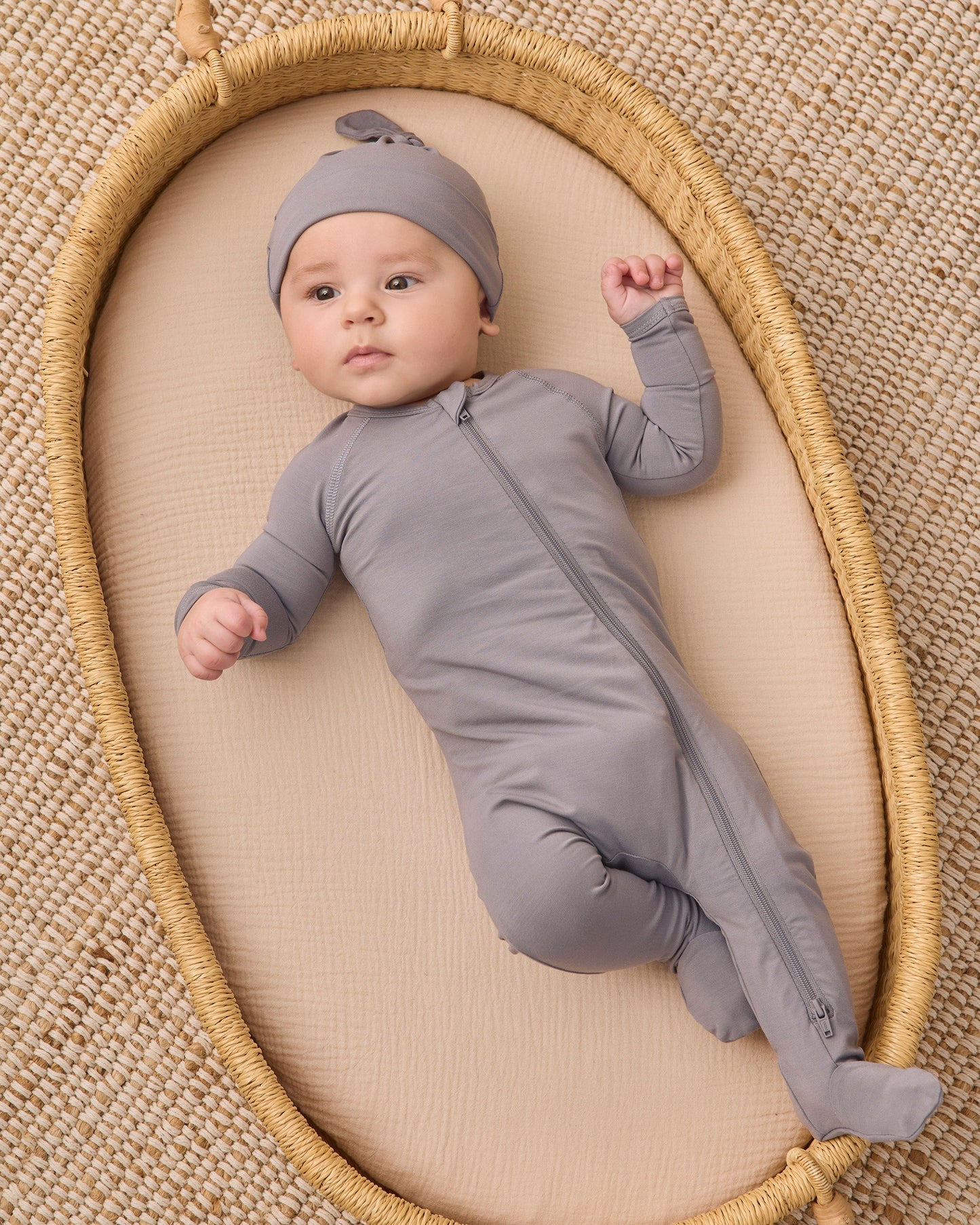 Slate Bamboo Zip Footie, studio photo on baby