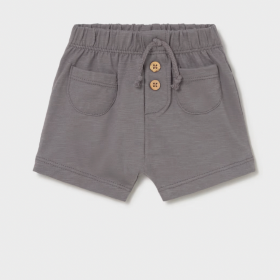 Gray shorts with button details on a light gray background