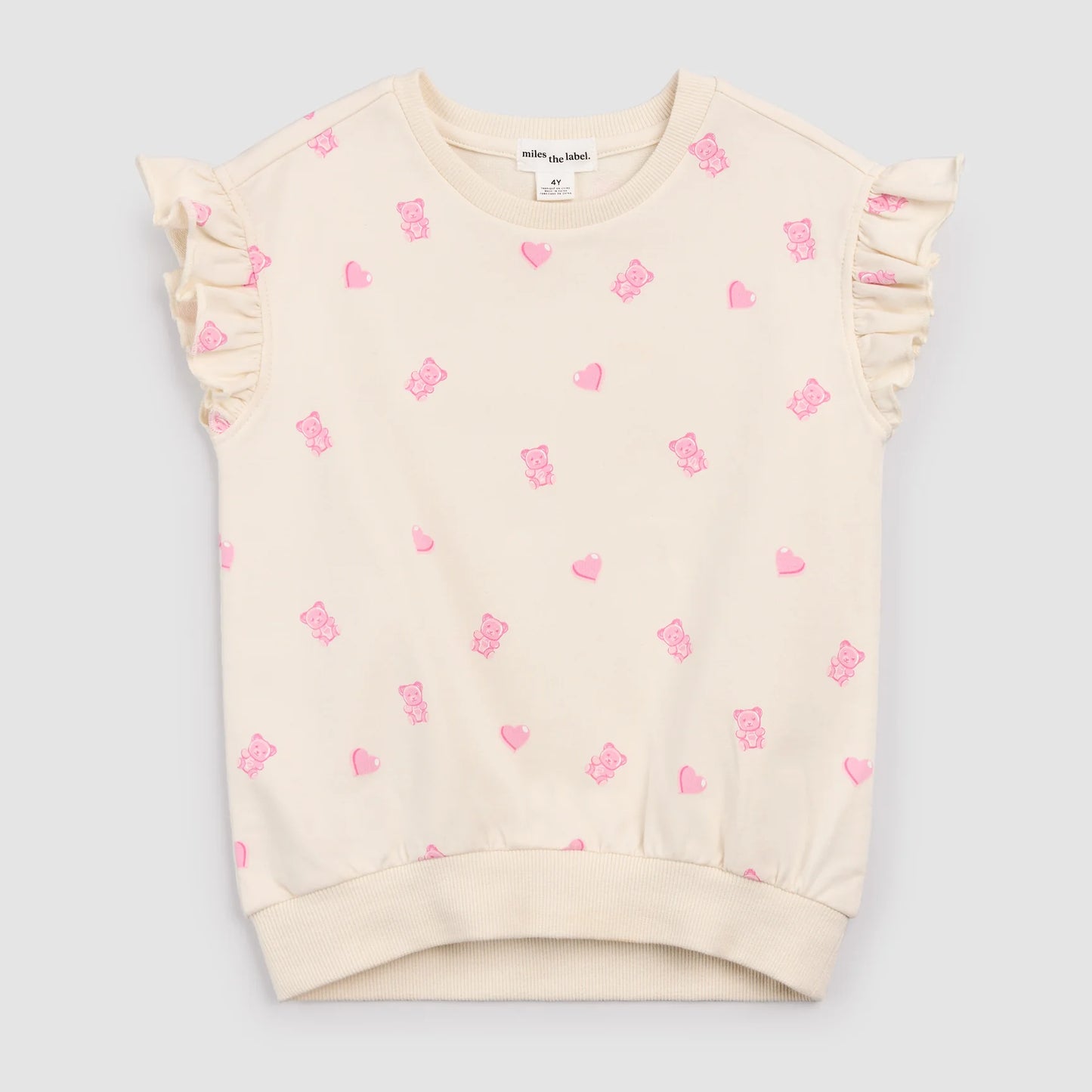 Cream sleeveless top with pink gummy bears and heart patterns 