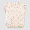Cream sleeveless top with pink gummy bears and heart patterns 