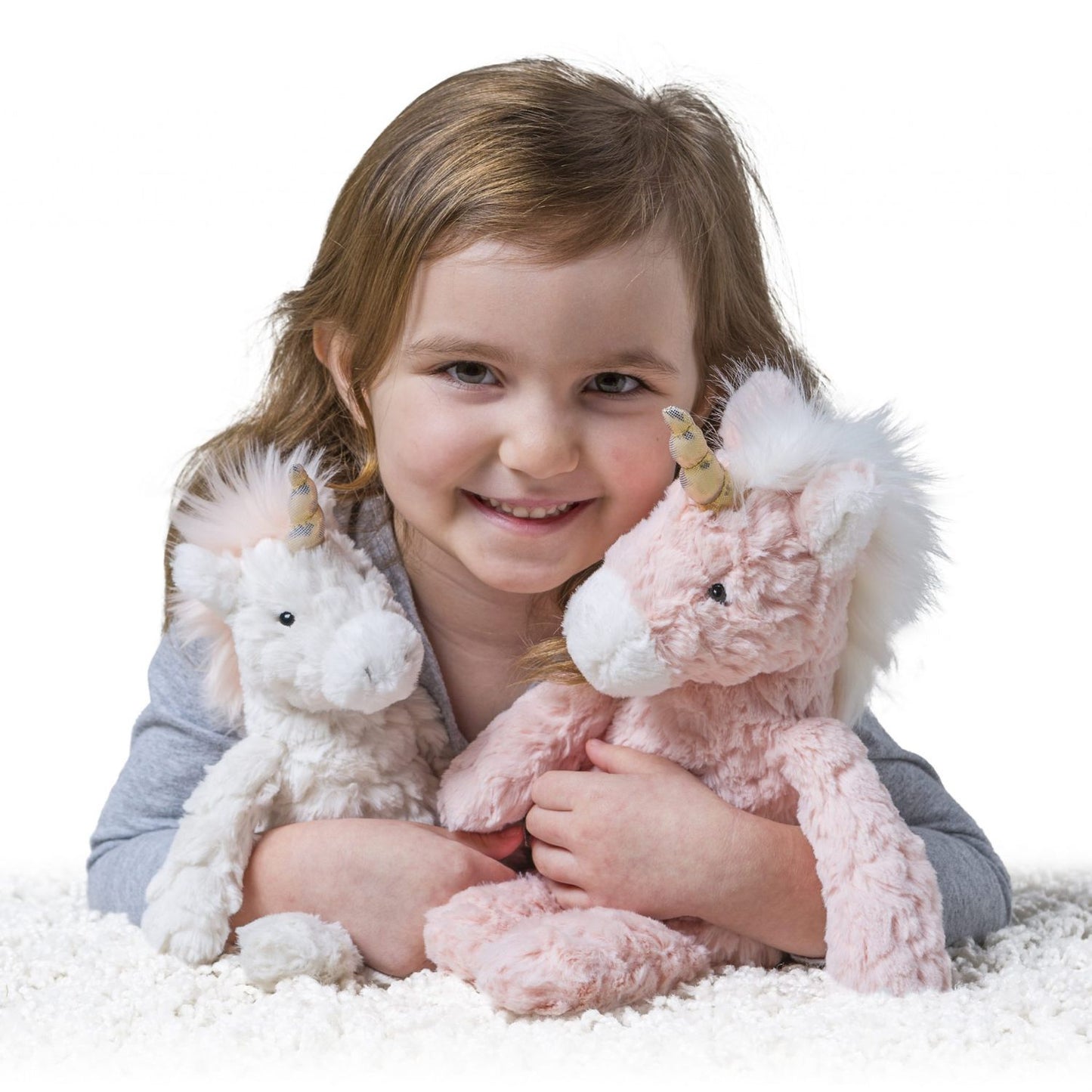 Soft cream unicorn plush with luxe textured details