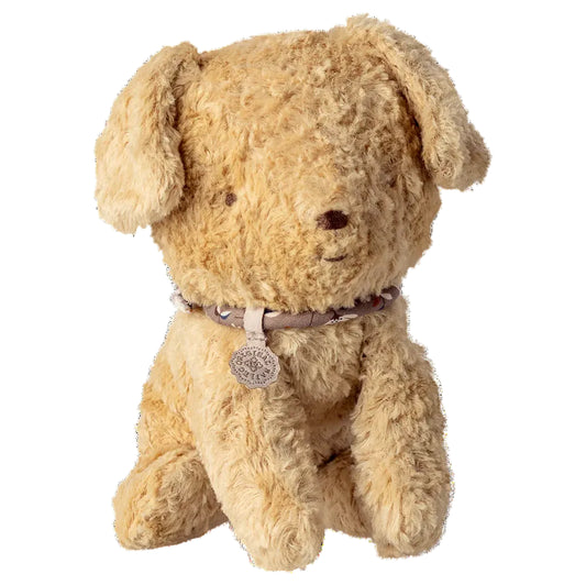 Beige stuffed dog toy with a collar