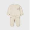 Beige children's sweatshirt and jogger set with a rainbow design 