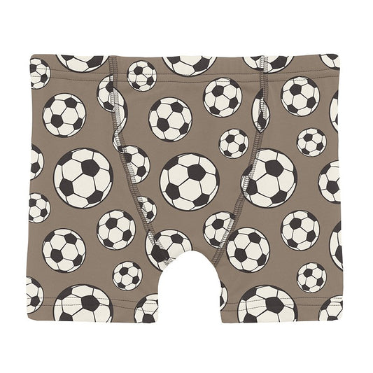 Boy's underwear with soccer ball pattern on a brown background