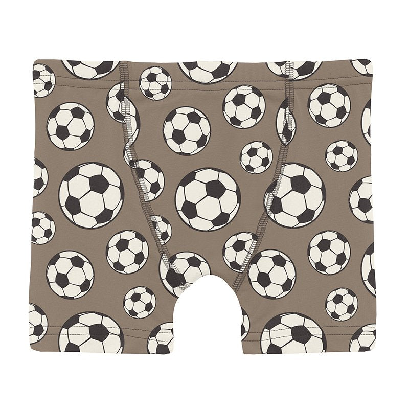 Boy's underwear with soccer ball pattern on a brown background
