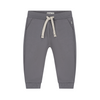A pair of children's gray sweatpants with a patterned cream and gray drawstring, ribbed cuffs, and side pockets, shown against a plain white background.