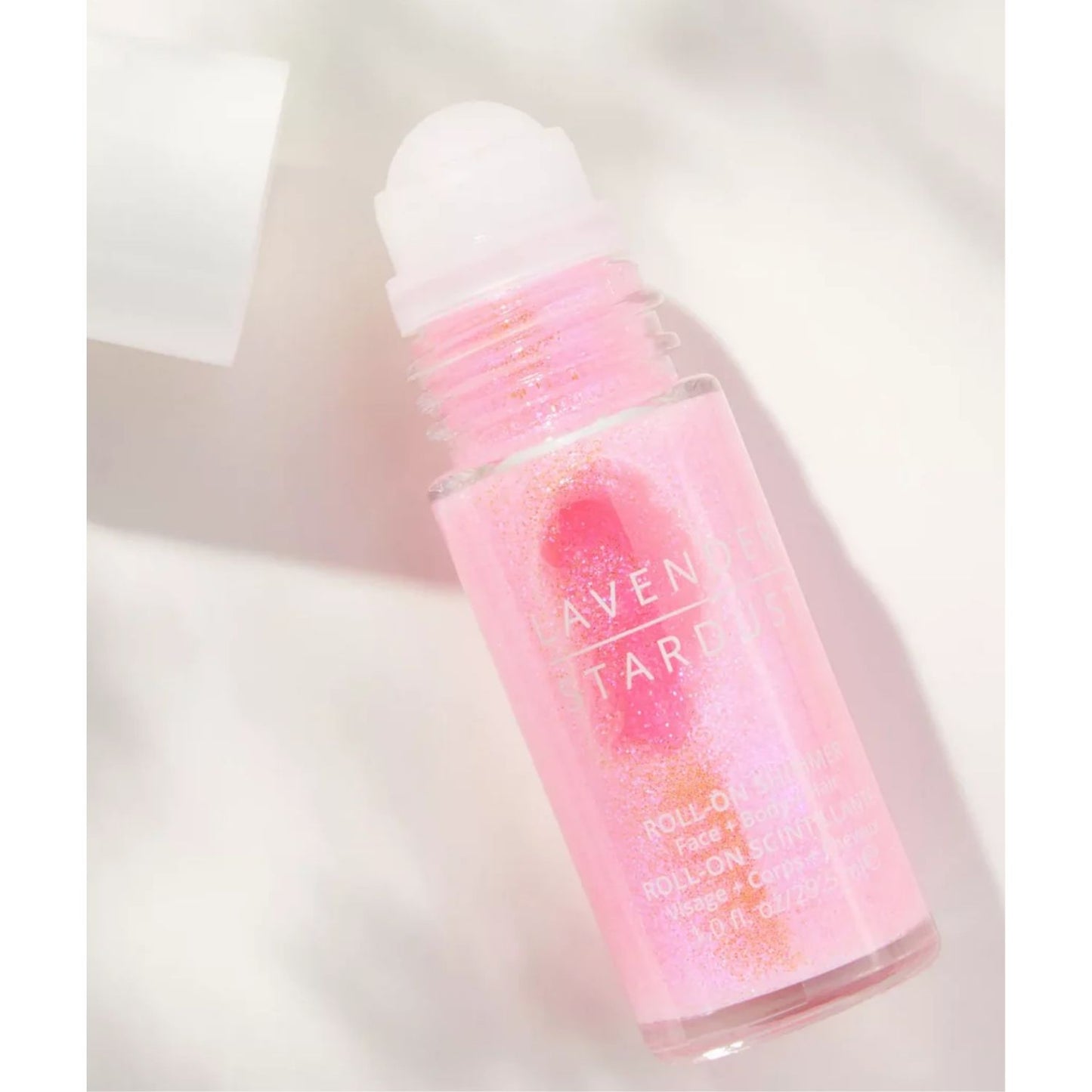 Pink roll-on shimmer with sweet strawberry scent