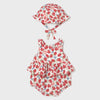 Baby romper and hat set with strawberry pattern on a white background